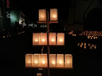 Illuminated lamp in city at night