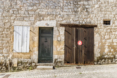 Monflanquin, france - october 17, 2021 architectural detail of typical houses in the city center