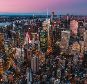 Aerial view of cityscape against sky during sunset