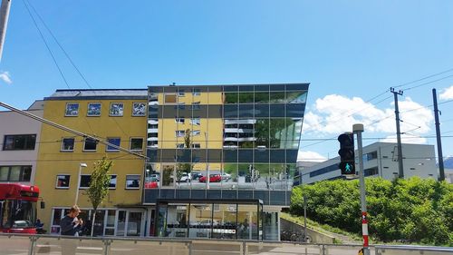 Buildings in city against clear sky