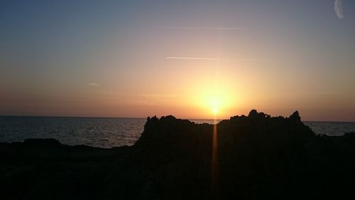 Scenic view of sea against romantic sky