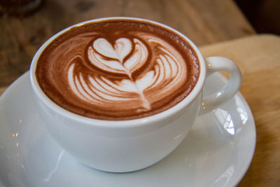 Close-up of cappuccino on table