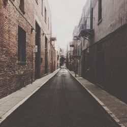 Street amidst buildings in city against sky