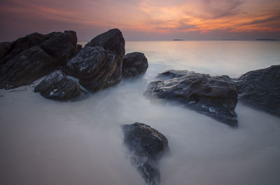 Scenic view of sea against sky during sunset