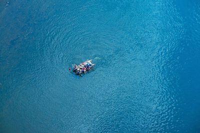 High angle view of people in boat on sea