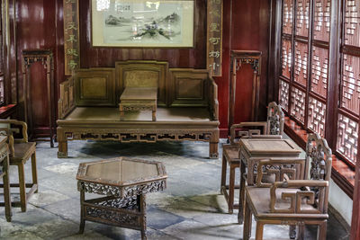 High angle view of empty chairs and table in building