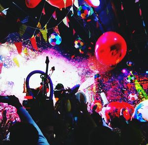 Group of people standing in front of fire crackers