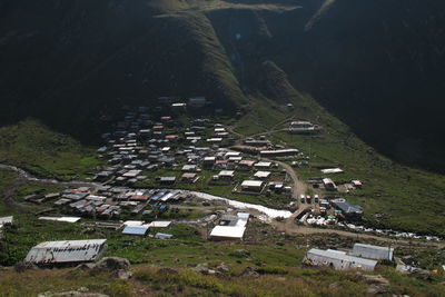 High angle view of townscape on field by buildings