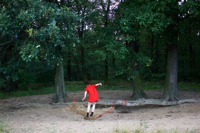 Full length of a girl on tree