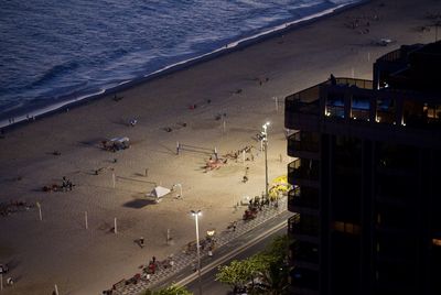 High angle view of people on beach at night