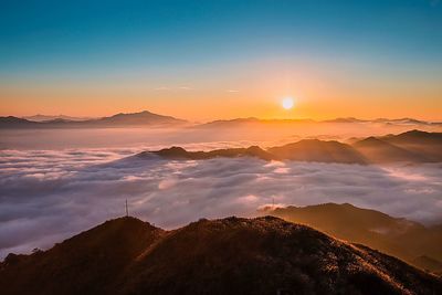 Scenic view of mountains against sky during sunset