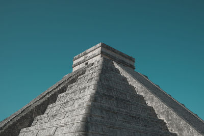 Low angle view of historical building against blue sky