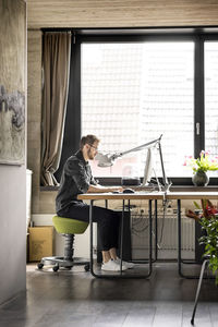 Man working at desk at home