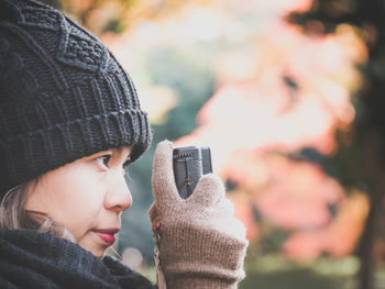 Close-up of woman photographing