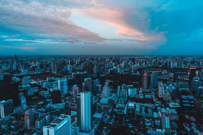 High angle view of modern buildings in city against sky