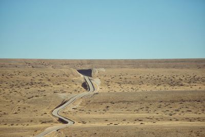 Scenic view of desert against clear sky