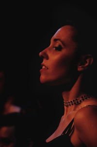 Close-up portrait of young woman looking away