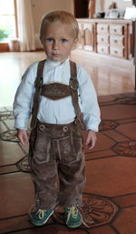 Portrait of cute boy standing at home