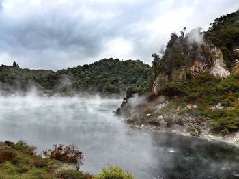 Scenic view of sea against cloudy sky