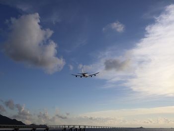 Low angle view of airplane flying in sky