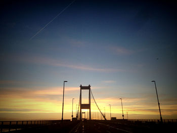 Low angle view of bridge against sky during sunset