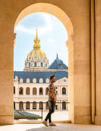 Rear view of man standing in historic building