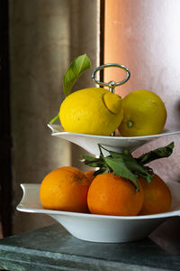 Fruits in bowl on table