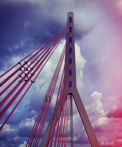 Low angle view of suspension bridge against sky