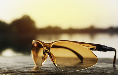 Close-up of sunglasses against blurred background