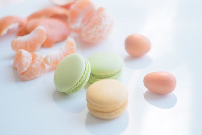 Close-up of multi colored candies against white background