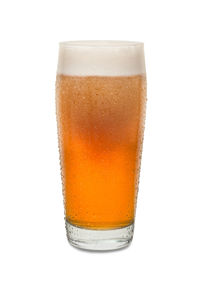 Close-up of beer glass against white background