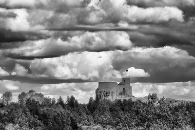 Castle on field against sky