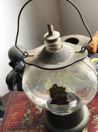 Close-up of old electric lamp on table