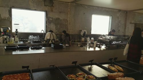 People working in kitchen