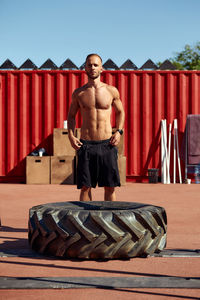 Rear view of man standing against wall