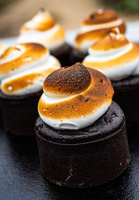 S'mores toasted marshmallow merengue swirls on chocolate brownie cakes