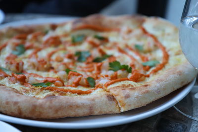 Close-up of pizza in plate on table