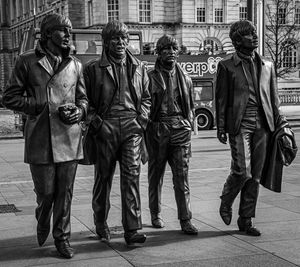 People walking on street in city