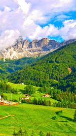 Scenic view of landscape and mountains against sky