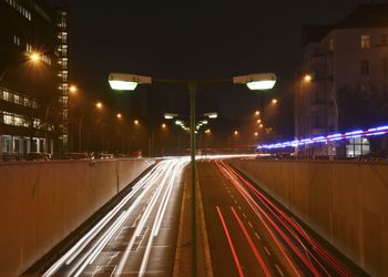 High angle view of light trails on road in city at night