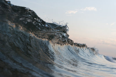 Close-up of sea waves splashing on shore