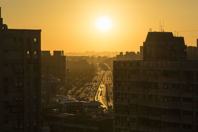 High angle view of buildings at sunset