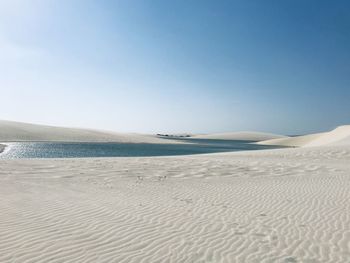 Scenic view of beach against clear sky