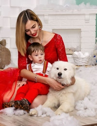 Portrait of young woman with dog