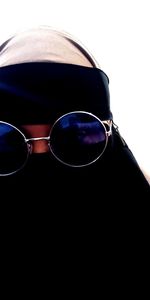 Close-up of sunglasses against black background