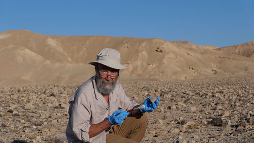 Archaeologist at work in the desert 