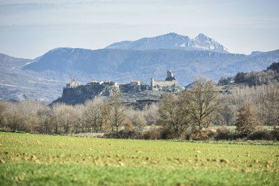 Landscape with mountain range in the background