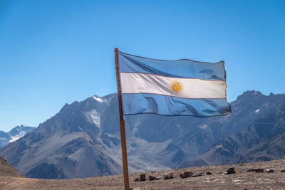 Low angle view of mountain against clear blue sky