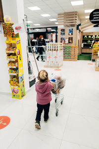 Full length of woman standing in store