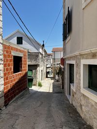 Alley amidst buildings in city